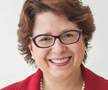 Headshot of Sue Schade, a Principal at Starbridge Advisors, comments on the future of remote work in healthcare 