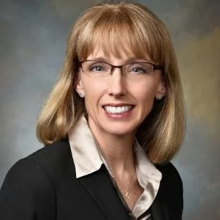 Headshot of Jamie Reedy, MD who joins This Week Health to discuss value-based care